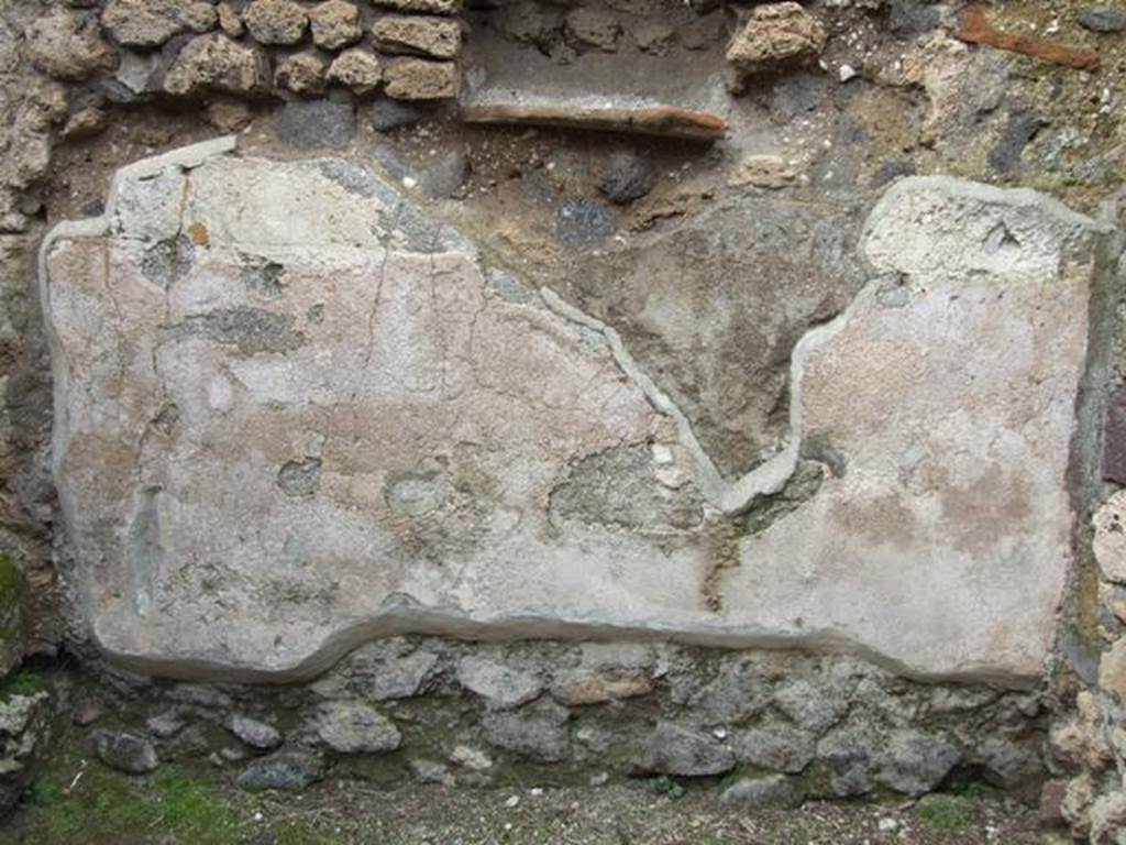 VII.4.48 Pompeii. March 2009. Room 9, remains of plaster under niche on the north wall.