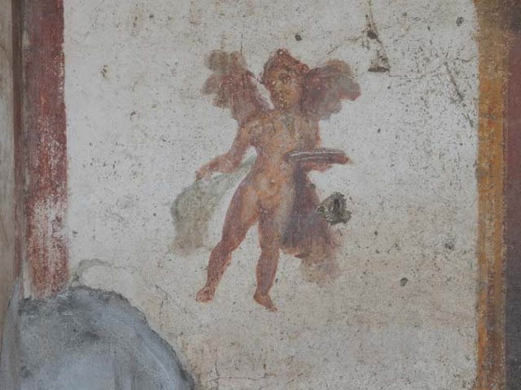 VII.4.48 Pompeii. May 2015. Room 14, flying figure from south end of west wall of cubiculum. Photo courtesy of Buzz Ferebee.