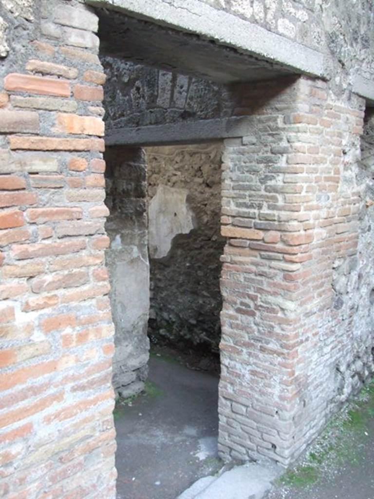 VII.4.48 Pompeii. December 2007. Doorway to room 20, corridor leading from peristyle to entrance VII.4.43, with doorway to room 21 in south wall.
