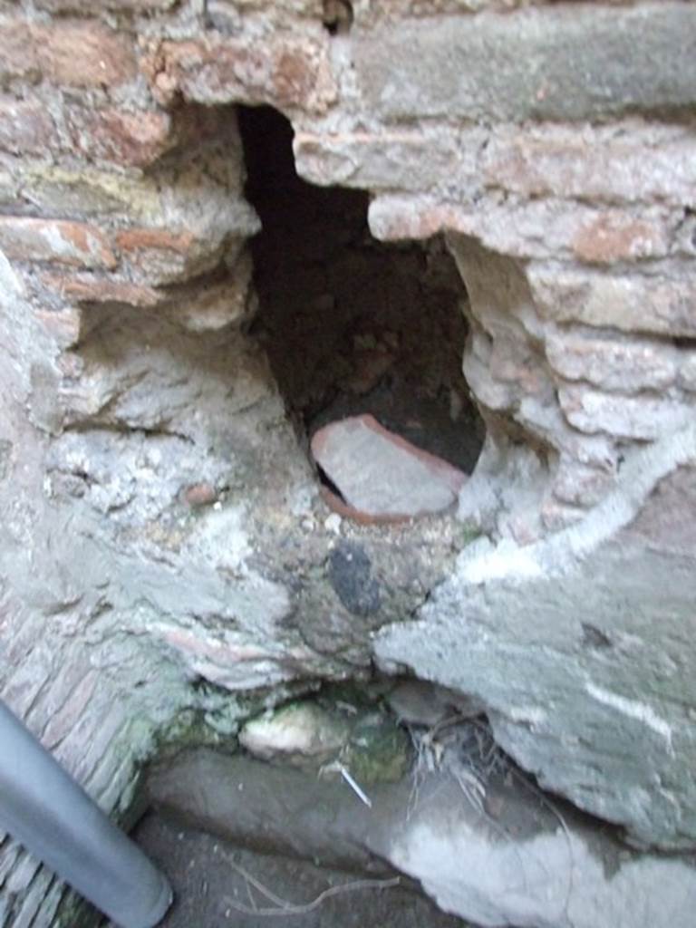 VII.4.48 Pompeii. December 2007. Room 21. Latrine. Possible terracotta pipe from upstairs latrine in wall.