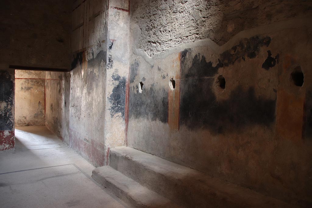 VII.5.8 Pompeii. October 2024.
Room 46, looking north along east wall of Apodyterium, towards doorway to corridor 45, on left. Photo courtesy of Klaus Heese.