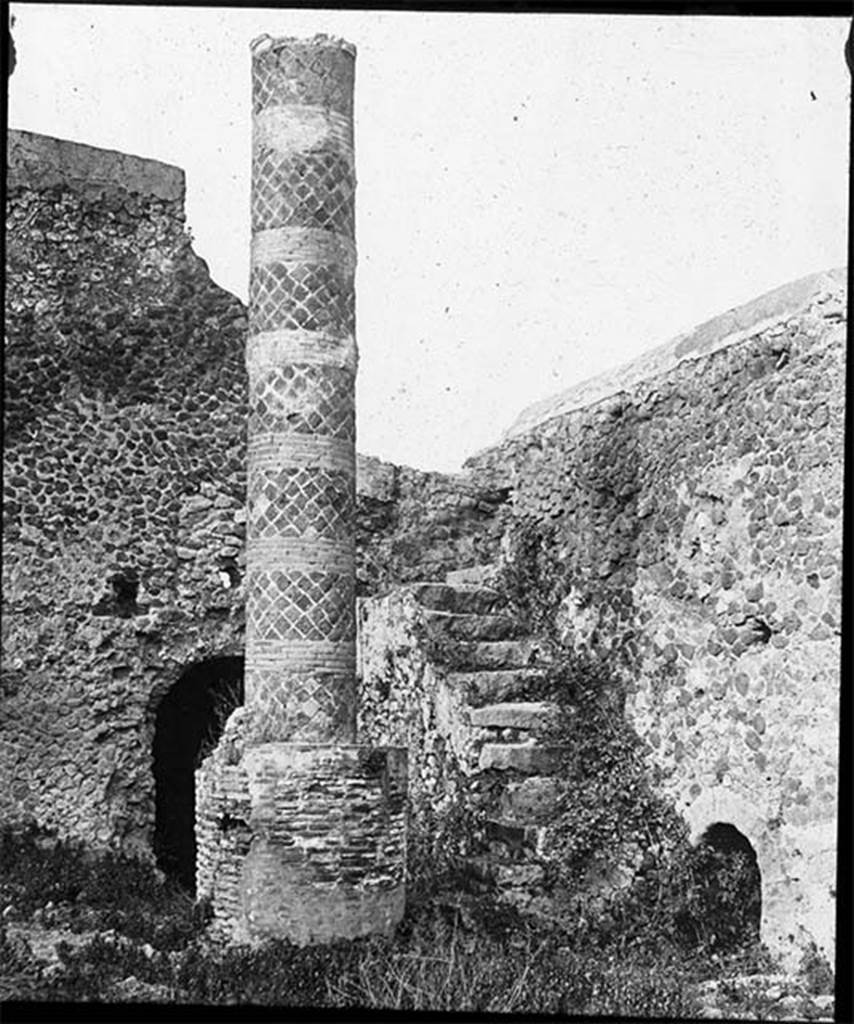 VII.5.10 Pompeii. Lantern slide, date unknown. Forum Baths Courtyard (33) with column (34) and staircases (35) and (36). Photo by permission of the Institute of Archaeology, University of Oxford. File name Instarchbx208im 070 Source ID. 44396.
See photo on HEIR Project.