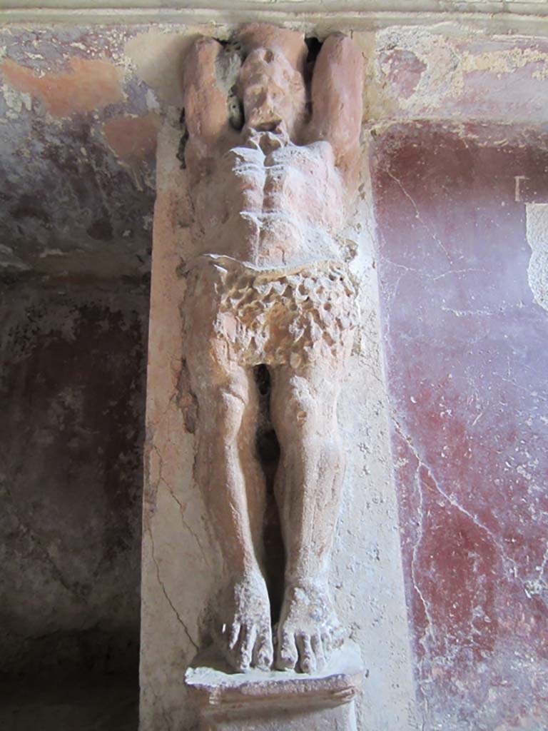 VII.5.24 Pompeii. March 2012.
Detail of a telamon on east wall in the tepidarium (37). Photo courtesy of Marina Fuxa.