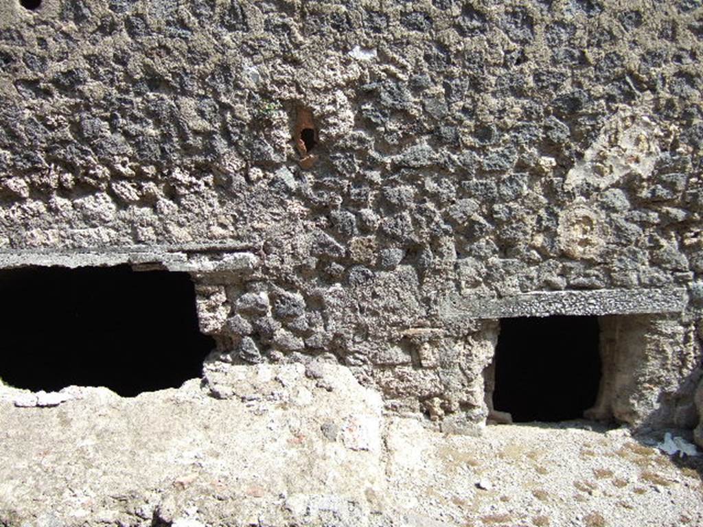 VII.6.3 Pompeii. September 2005. Windows of underground rooms (g) kitchen and (f) latrine. These are at pavement level in the outside wall on Vicolo del Farmacista.