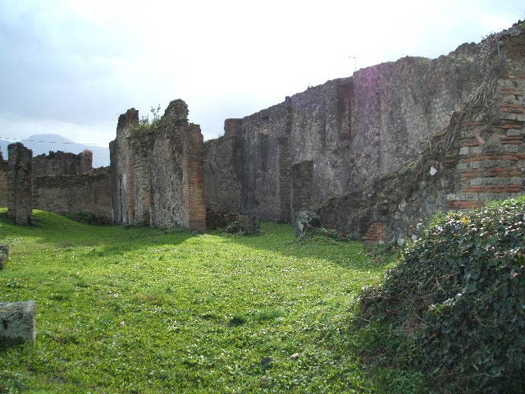 VII.6.3 Pompeii. December 2004. Looking south-west. According to Garcia y Garcia, the bombing of 13th September 1943 resulted in the destruction
- of the prothyron, and four rooms to the north and north-east of the atrium.
- three columns of the portico were knocked down in the south-east corner of the peristyle.
- in the west ala, the beautiful mosaic in black and white which had been disturbed in the last days of Pompeii by the construction of a wall for a cupboard base, just before its ruin by Vesuvius (Fig.232 on page 104).
According to the map of the bombing (on page 26) 5 bombs hit this insula.
Diary of Incursions on page 31-34 lists the damage to the surrounding houses –
13th September 1943 (17.00 hrs)
(listed as VII.vii.3, but probably VII.vi.3) south and south-east of the peristyle, part of the south perimeter wall.
VII.vi.28, north and north-west of the peristyle
VII.vi.38, south-west of the house and neighbouring rooms.
VII.vi.7, west of the atrium and south-west of peristyle.
See Garcia y Garcia, L., 2006. Danni di guerra a Pompei. Rome: L’Erma di Bretschneider. (p.102 & p.104, Fig.232).