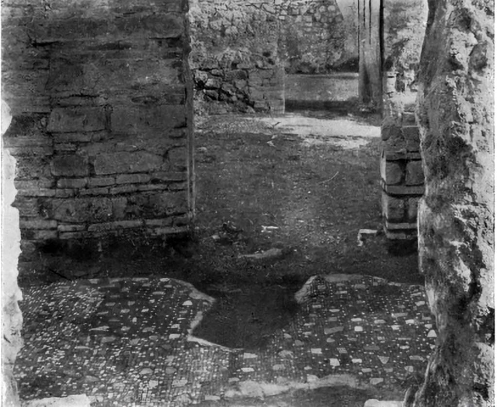 VII.6.3 Pompeii. c.1930.
Looking east from corridor 17, across flooring of corridor 15, through doorway into tablinum 12 and across towards doorway to room 13.
The doorway to Room 14, and corridor 15 are on the left.
The doorway to Room 19, and stairway 16 would be on the right.
According to Blake,
Only one other pavement employs limestone pieces alone to give colour to a black background.
In a corridor of VII.6.3 (pl.13, fig.4 above), the irregular pieces of coloured limestone have been retained, although the fine tesserae of the background
(0.7cm to 1cm) have been almost entirely replaced by coarser (1cm to 1.3cm).
See Blake, M., (1930). The pavements of the Roman Buildings of the Republic and Early Empire. Rome, MAAR, 8, (p.61, & pl.13, fig.4).