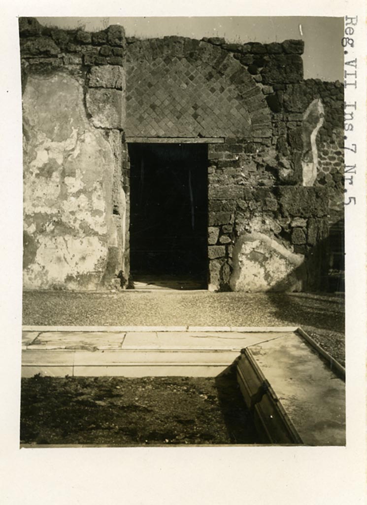 VII.7.5 Pompeii. Pre-1937-39.
Looking east across impluvium in atrium towards doorway to room g, in centre of east side of atrium.
Photo courtesy of American Academy in Rome, Photographic Archive. Warsher collection no. 1443.