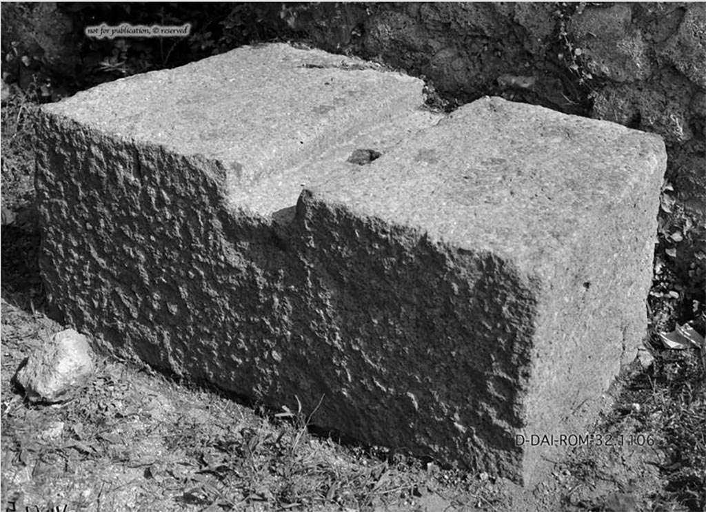 VII.7.5 Pompeii. 1932. Chest/money storage base, found on east side of south side of atrium next to doorway into VII.7.4.
According to Pernice –
Chest base. Found in the atrium to the right of the door that leads from a shop next to the main entrance into the atrium.
Lava block with a groove running across the surface, with a hole in the center with traces of iron.
See Pernice, E., 1932. Hellenistische Tische, Zisternenmündungen, Beckenuntersätze, Altäre u. Truhen. Berlin, p. 74, Taf. 44.5.
DAIR 32.1106. Photo © Deutsches Archäologisches Institut, Abteilung Rom, Arkiv.
Thanks to Espen B. Andersson for assisting us in our interest in money-chests.
