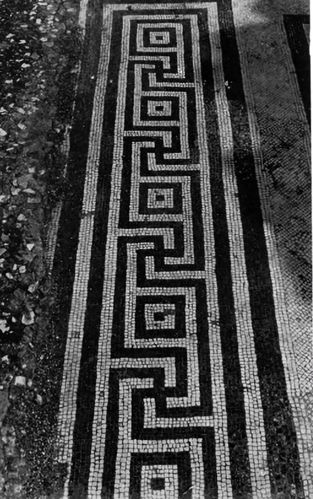 VII.7.5 Pompeii. c.1930. Flooring, showing threshold of the left ala (room e).
According to Blake –
With the more general use of marble, one finds marble fragments combined with those of the coloured limestone, as for example in the atria of V.1.7 and of VII.7.5. In the latter, the pavement is clearly later than the mosaic borders of the alae which in part it covers; it seems to belong to the period of the marble impluvium. (p.31).
In VII.7.5, the right ala has the meander with every square different, while the left uses the simplified form. (p.84)
See Blake, M., (1930). The pavements of the Roman Buildings of the Republic and Early Empire. Rome, MAAR, 8, (p.31, p.84 & Pl.21, tav. 1)