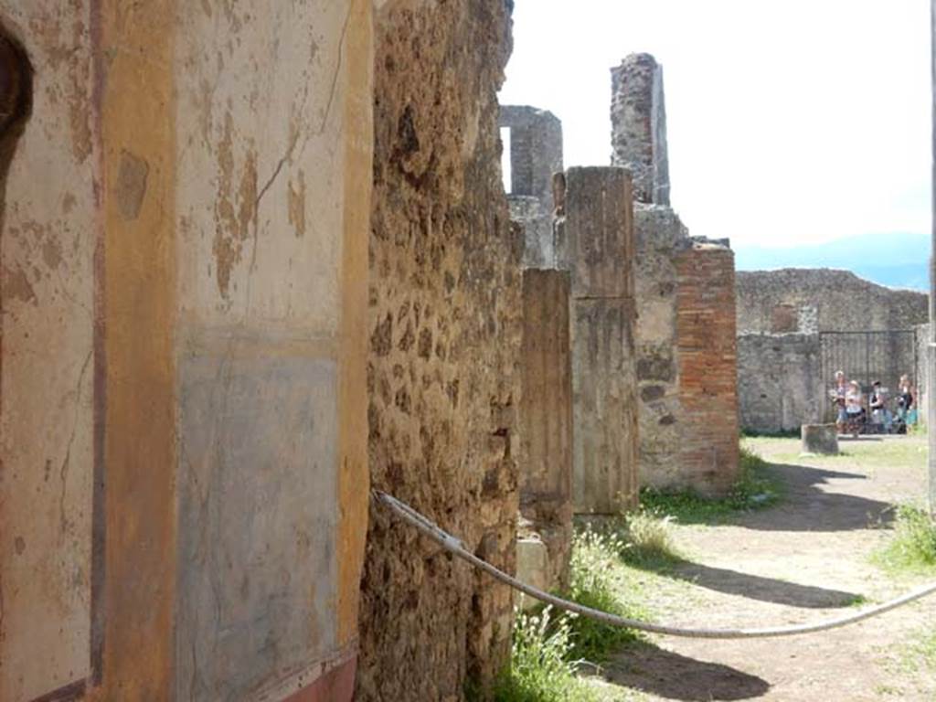 VII.7.10 Pompeii. May 2018. Looking south along east wall/side of peristyle towards atrium.
Photo courtesy of Buzz Ferebee.