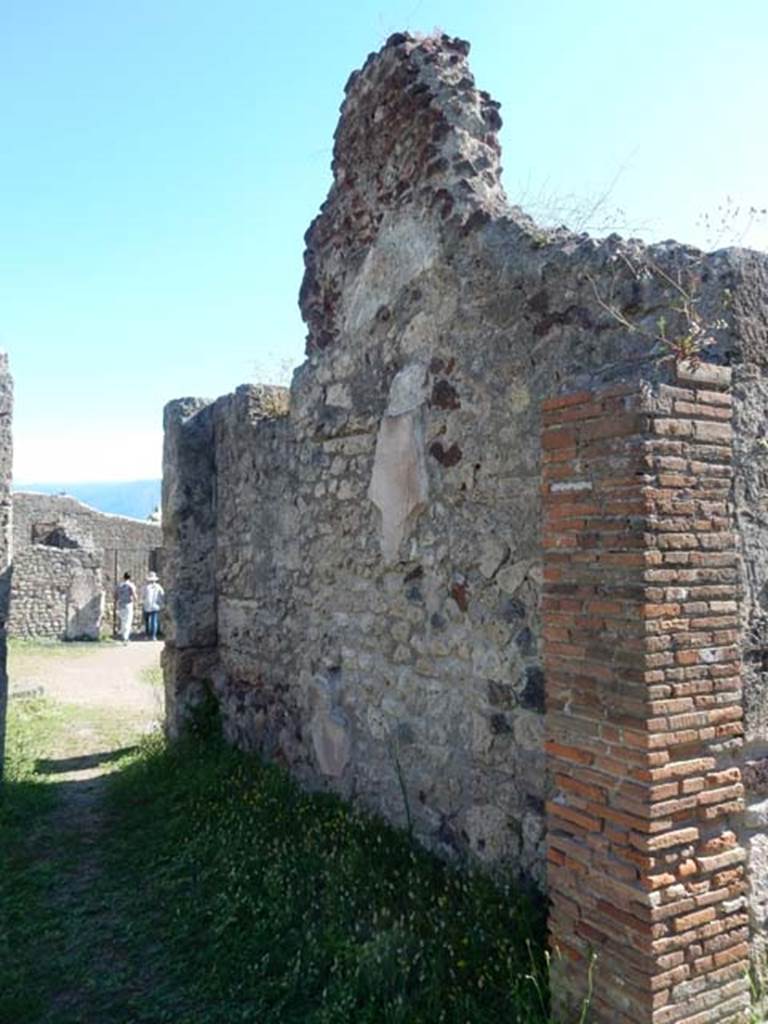 VII.7.10 Pompeii. May 2018. Room (n), an oecus, looking towards doorway to atrium and west wall.
Photo courtesy of Buzz Ferebee.
According to PPM, “in this room, to the left of where you enter, therefore probably on the west wall, the painting of Romulus and Remus with the wolf was found, but already very badly preserved when it was found in 1864.”