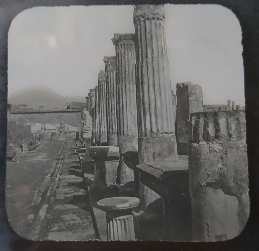 VII.7.32 Pompeii. c.1900. C. and G. Lantern slide published by A. Laverne.
Looking north along east portico towards north wall, still with painted decoration. The Forum is on the right.