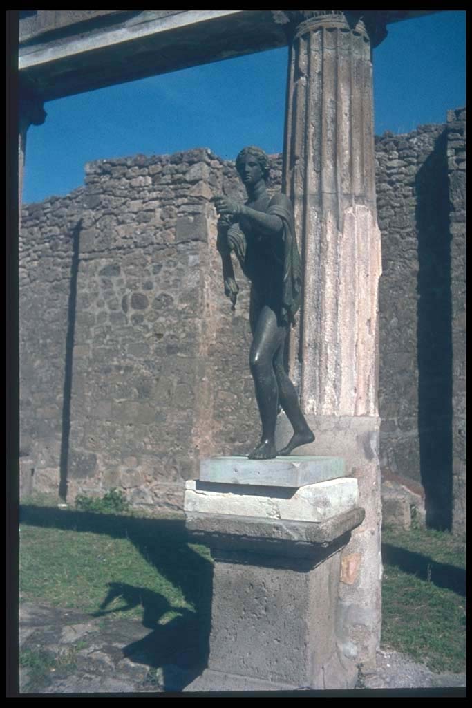 VII.7.32 Pompeii. Statue of Apollo on east side of Temple of Apollo, in front of the third column.
Photographed 1970-79 by Günther Einhorn, picture courtesy of his son Ralf Einhorn.