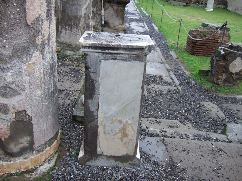 VII.7.32 Pompeii. December 2005. West side. Pedestal that used to hold a statue.
There were three statues on either side, grouped in pairs.
All original statues are now in the Naples Archaeological Museum.
See Mau, A., 1907, translated by Kelsey F. W. Pompeii: Its Life and Art. New York: Macmillan. (p.87)