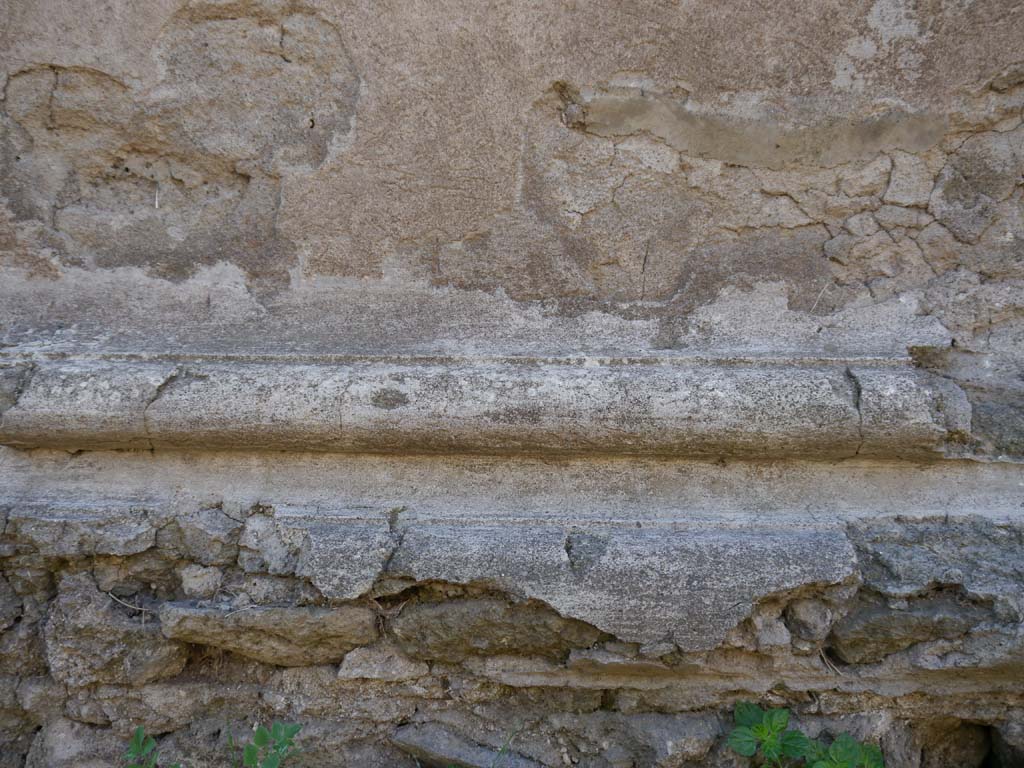 VII.7.32, Pompeii. September 2018. Detail from the north side of the podium base.
Foto Anne Kleineberg, ERC Grant 681269 DÉCOR