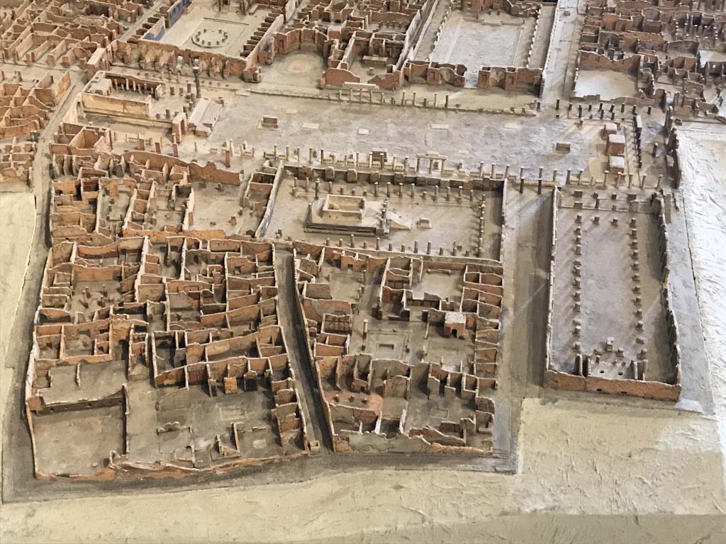 VII.8 Pompeii Forum, across top of photo. April 2019.
Looking towards east side of Forum, with VII.9.7/8 Macellum, VII.9.6 towards VII.9.1, Eumachia’s Building, in centre top.
The lower part of the photo consists of VII.15 (on left), VII.7 in centre, with Temple of Apollo (VII.7.32) on west side of Forum,
Via Marina leading towards the Forum, with Basilica, VIII.1.1, on right.
Model now in Naples Museum. Photo courtesy of Rick Bauer.