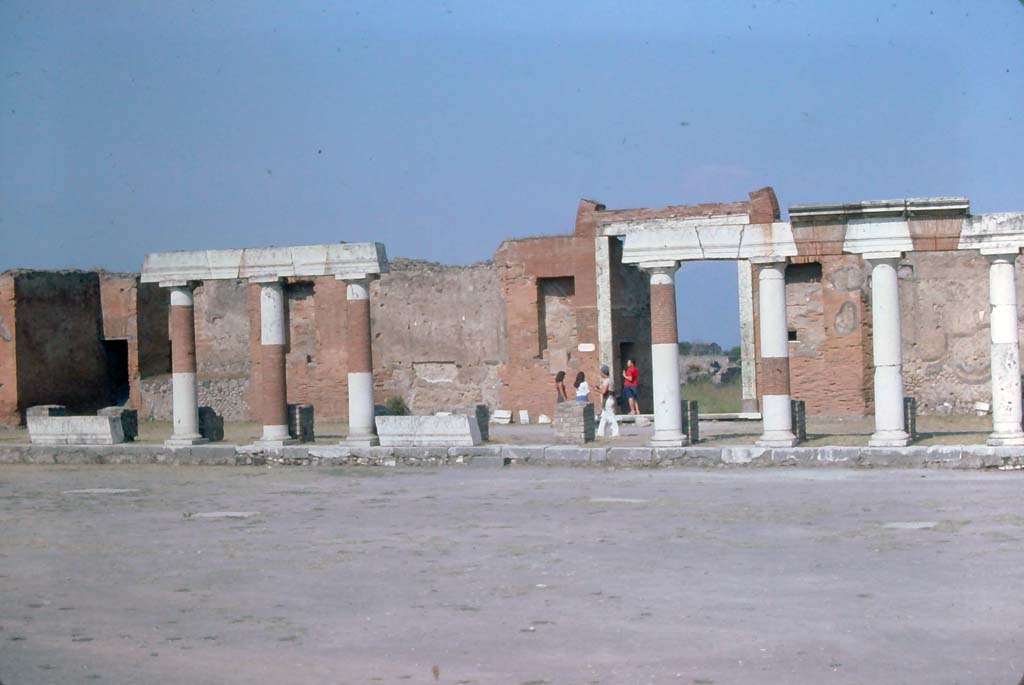 VII.8.00 Pompeii, 7th August 1976. Looking east across Forum towards Eumachia building portico.
Photo courtesy of Rick Bauer, from Dr George Fay’s slides collection.
