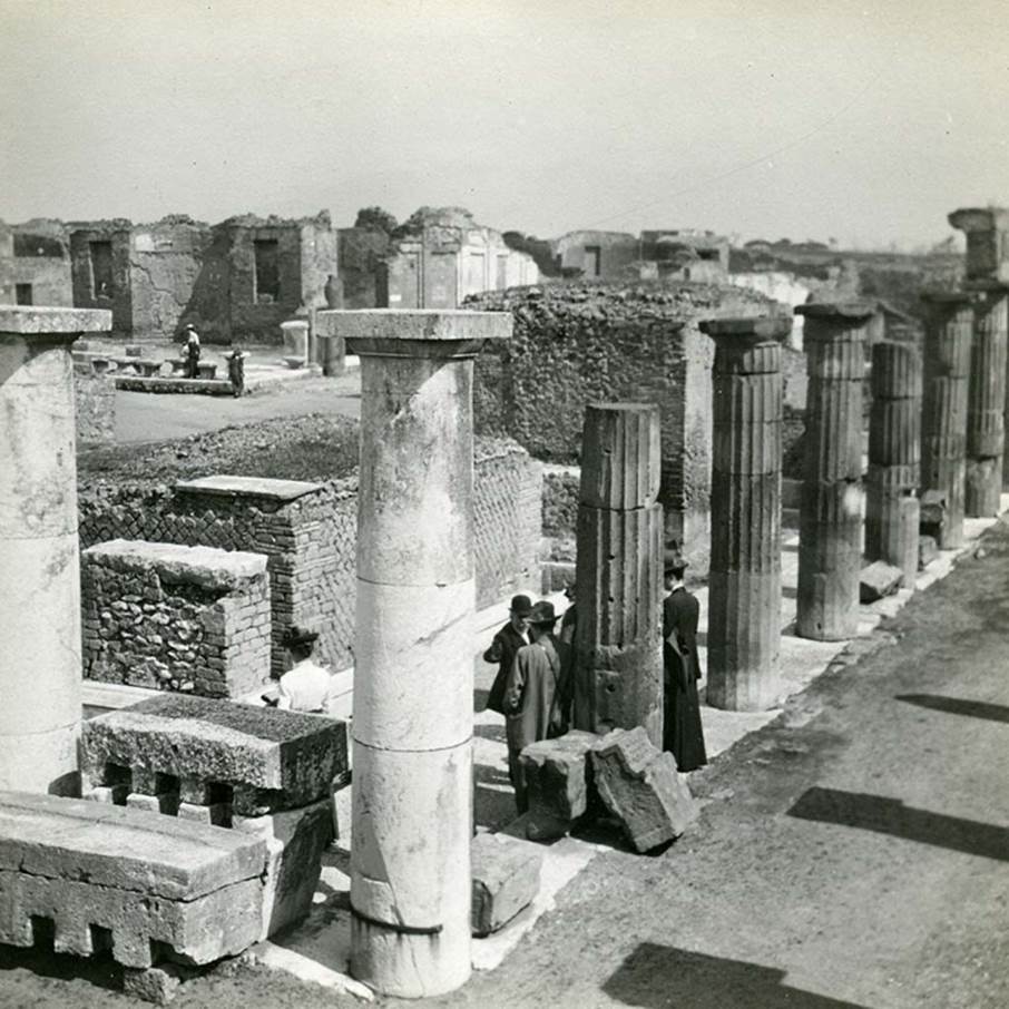 VII.8 Pompeii Forum. 1912.
Looking east along south side, from south-west corner, with the colonnade of Popidius, on the right.
Photo by Esther Boise Van Deman (c) American Academy in Rome. VD_Archive_Ph_235.
According to Van Buren –
“The colonnade of Popidius, which antedates the Roman colony, occupies all the South end and the southern part of the eastern side, and on the western side there are traces of it almost to the northern extremity.”
See Van Buren, Albert William. The Changes in the Forum due to the Roman Colonists. Part VI in Memoirs of American Academy in Rome, 1918, (p.75).