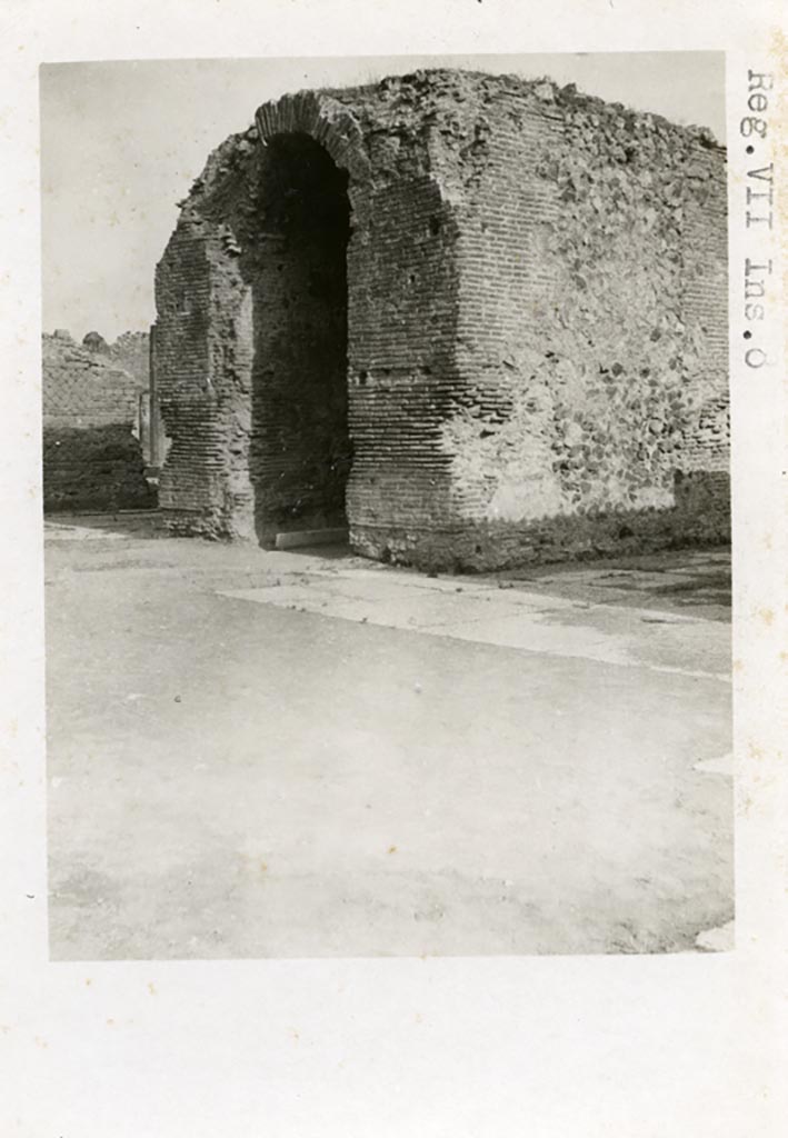 VII.8 Pompeii Forum. Pre-1937-39. Arched monument of Augustus (?) in centre of south side.
Photo courtesy of American Academy in Rome, Photographic Archive. Warsher collection no. 1123.
According to Van Buren –
“The centre of the south end of the Forum is occupied by a large rectangular arched structure of masonry, faced with opus incertum and tiles. It lies in the axis of the Capitolium and of the Forum. Mau (Note 2; Rom. Mitth, XI, 1896, pp.153 f.) proposed the conjecture that this is a base which once supported a statue of Augustus, and he made use of this conjecture in connection with an elaborate theory as to the identification of the various statues which once stood on the bases in the Forum. He assumes a colossal bronze standing statue as best meeting the conditions of proportion and stability.
In the first place must be advanced an objection on the score of historical improbability. A glance at our Pl.25, fig.4 will show that if there ever was a standing statue on the arched structure in question, the statue was a colossus so huge as absolutely to dominate the Forum, and more than challenge comparison with the cult statue of Jupiter in the Capitoline temple facing. It is inconceivable that Augustus would have permitted, or that Tiberius would have tolerated, the erection of such a statue in Italy during their reigns: it was reserved for Nero and Domitian to assimilate themselves to divinity in so outspoken a fashion. ………………………………
I have no hesitation in proposing to identify the arched structure as simply the Ianus of Pompeii, and to associate its erection in its present form with some renewal or extension of the privileges of the city under the early Empire.”
See Van Buren, Albert William. The Arch at the South End of the Forum. Part III in Memoirs of American Academy in Rome, 1918, (p.72-73).