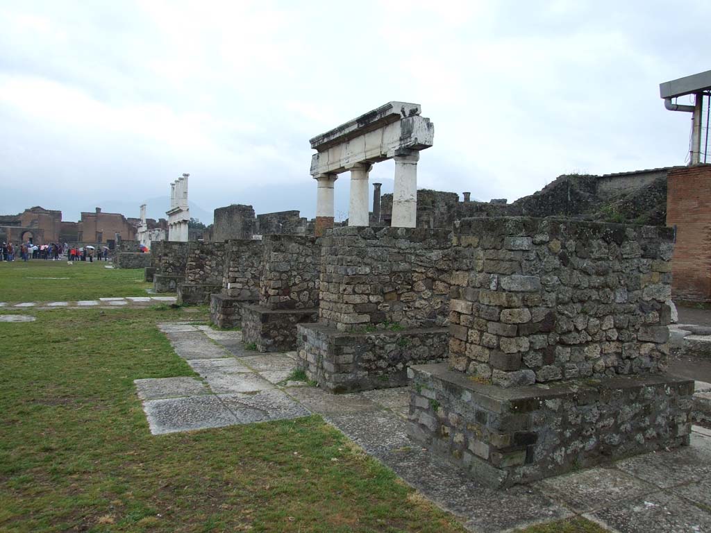 VII.8 Pompeii Forum. May 2010. Statue bases along the west side of the Forum, looking south.