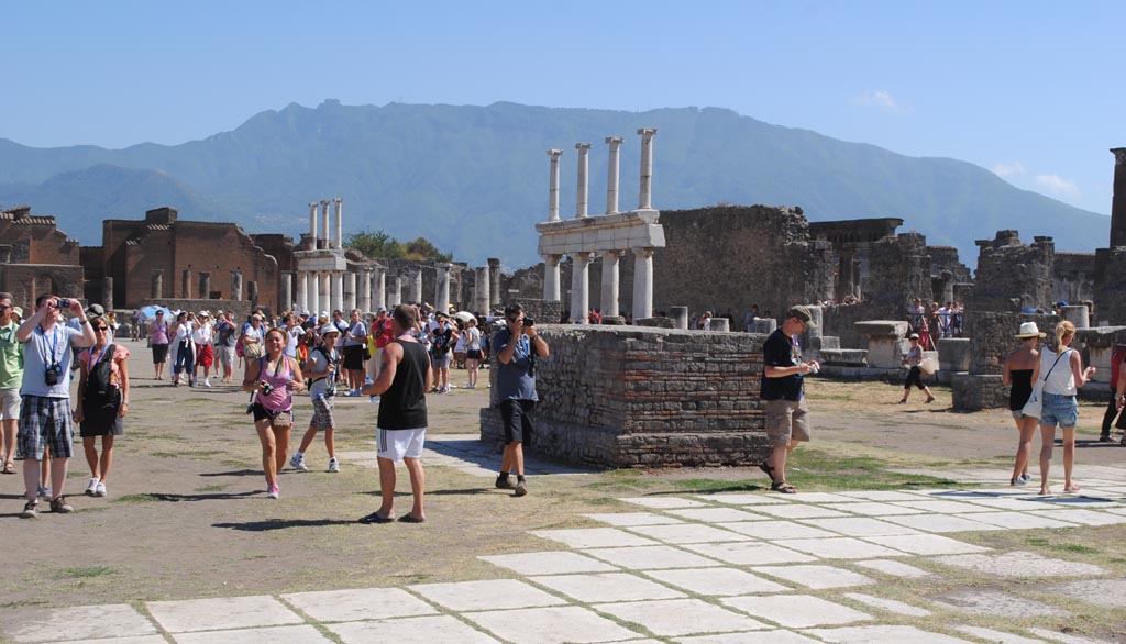 VII.8 Pompeii. July 2012.
Looking south-west across Forum. Note there are no horizontal beams at the top of the upper rows of columns.
Photo courtesy of John Vanko. His father took the identical photo in February 1952, see below.