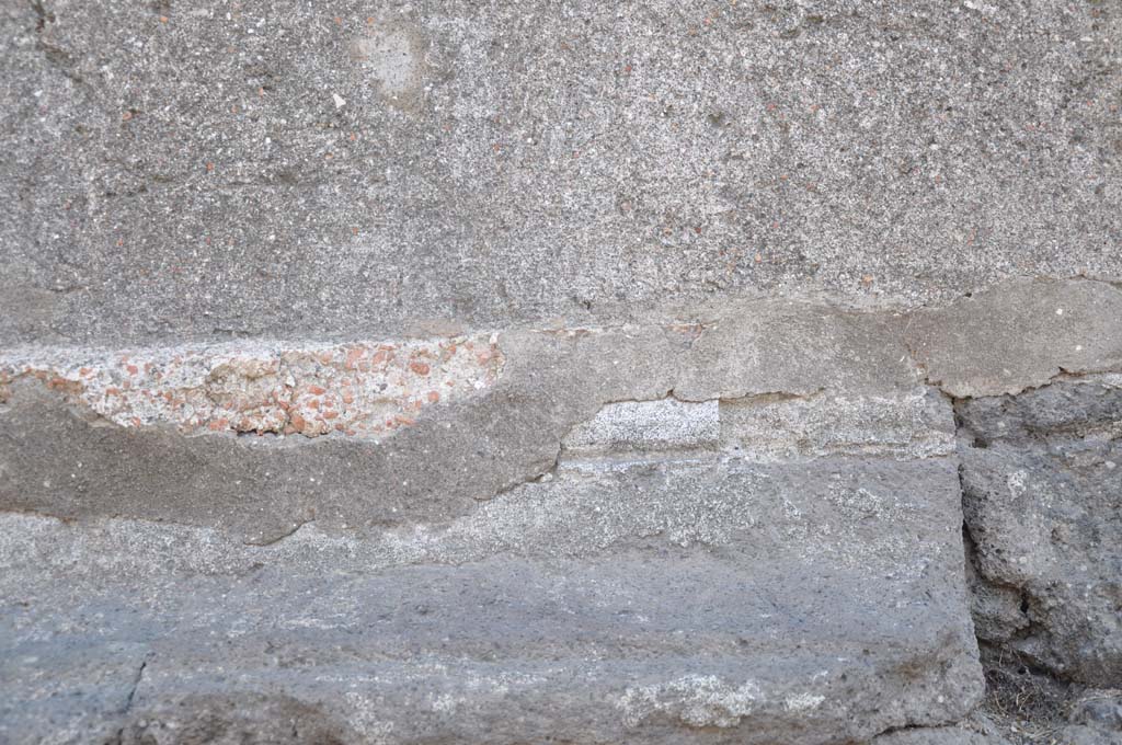 VII.8.01 Pompeii. July 2017. Detail from lower west exterior wall of Temple.