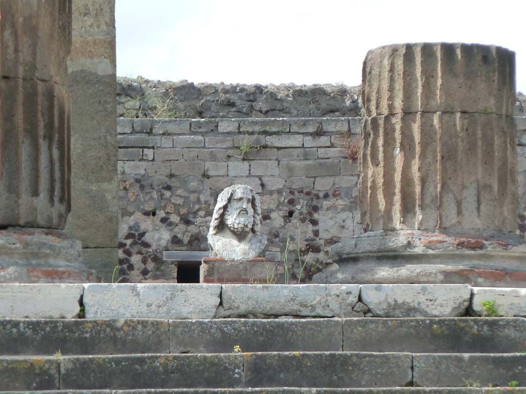 VII.8.1 Pompeii. May 2010. Head of Jupiter on podium of temple. This statue dated from the time of Sulla, approximately 80BC.