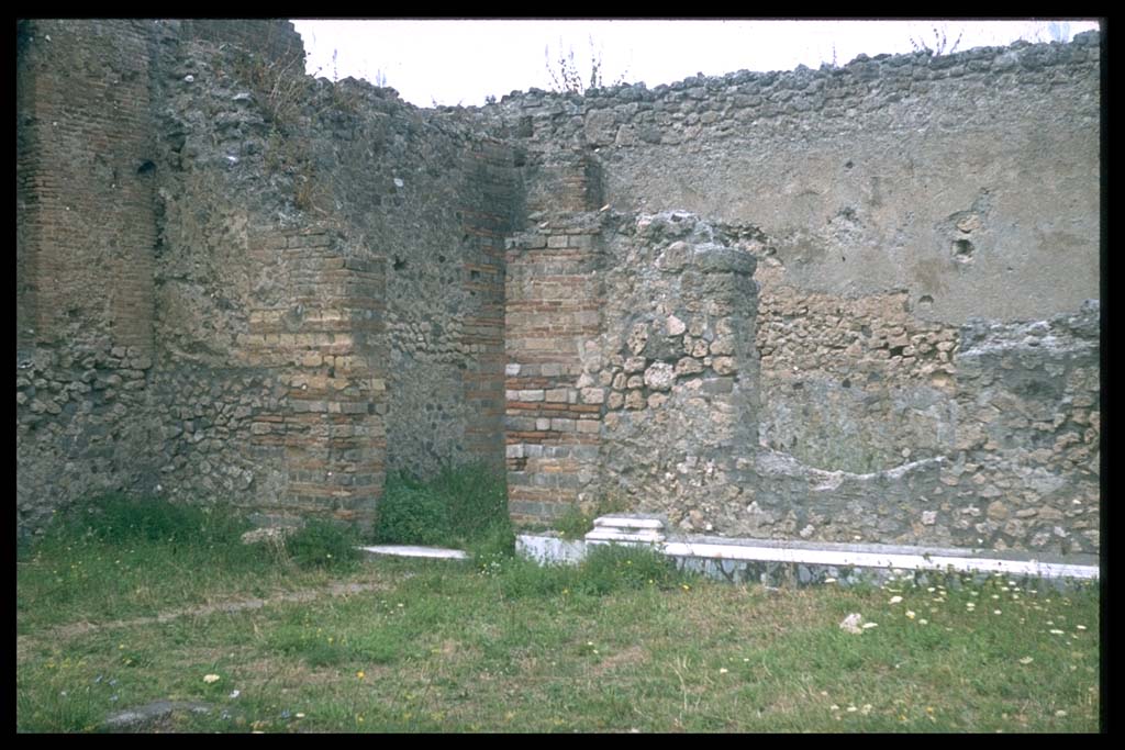 VII.9.1 Pompeii. North-west corner of colonnade 9, with remains of marble veneer.
Photographed 1970-79 by Günther Einhorn, picture courtesy of his son Ralf Einhorn.