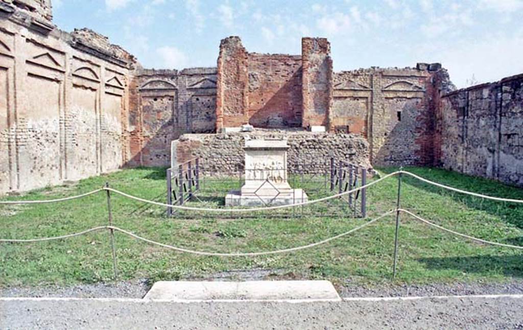VII.9.2 Pompeii. October 2001. Looking towards east wall with cella and podium, and altar, in centre. Photo courtesy of Peter Woods.