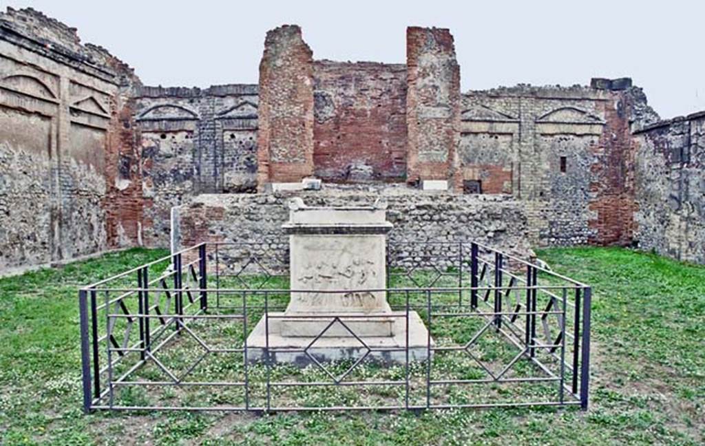 VII.9.2 Pompeii. October 2001. Looking towards east wall with cella and podium, and altar, in centre. Photo courtesy of Peter Woods.