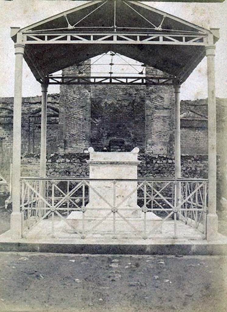 VII.9.2 Pompeii. Early 19th century? Photo of altar, cella and podium with protective roof cover over altar.
Photo courtesy of Ross Turner.