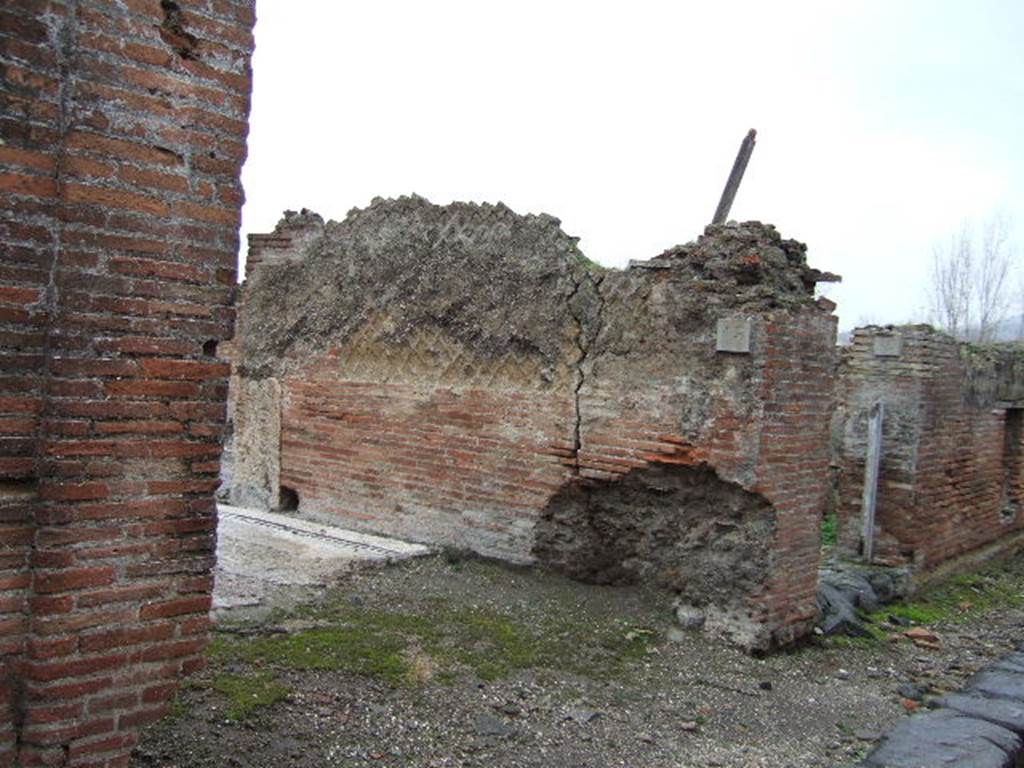 VII.16.15 Pompeii. September 2005. Room 2, looking west across impluvium in atrium. The impluvium had one of the Garum mosaics in each corner. In the Atrium at each corner of the impluvium was a black and white mosaic of an amphora with a Latin inscription for the four Roman fish sauces. Three of the four amphorae name Aulus Umbricius Scaurus, the wealthy Pompeian Garum producer and merchant. According to Clarke these had the inscriptions
G(ari) F(los) SCO(mbri) / SCAURI / EX OFFI(CI) / NA SCAU / RI
LIQUA(men) / FLOS
G(ari) F(los) SCOM(bri) / SCAURI
LIQUAMEN / OPTIMUM / EX OFFICIN / A SCAURI
See Clarke, J. R. in Dobbins, J. J. and Foss, P. W., 2008. The World of Pompeii. Oxford: Routledge. (p. 330).