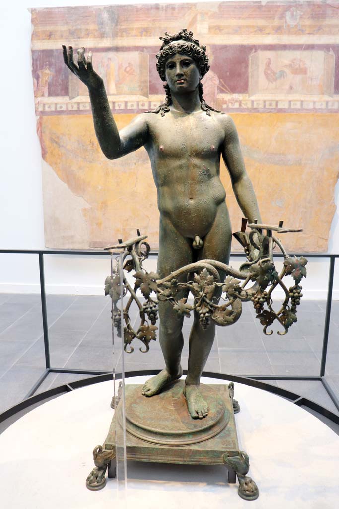 VII.16.17-22 Pompeii. February 2021.
Bronze Ephebus, used as an oil lamp holder, found in dining room.
Photo courtesy of Fabien Bièvre-Perrin (CC BY-NC-SA).