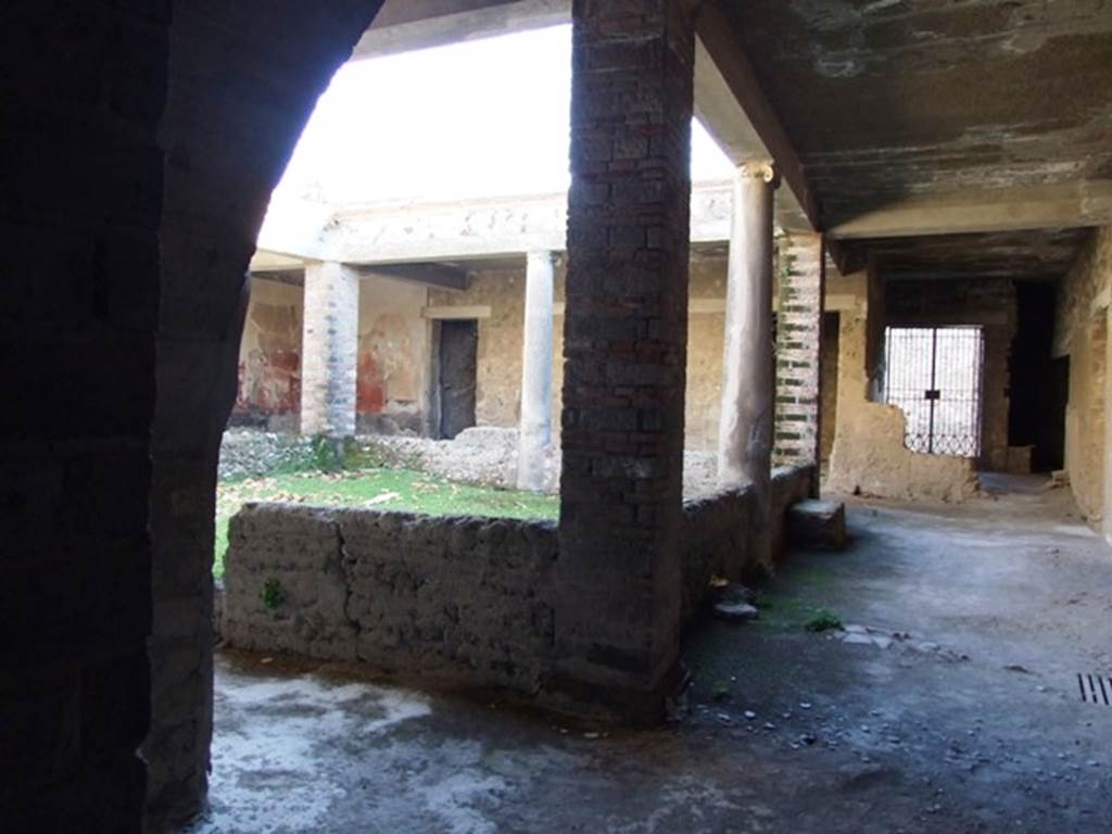 VII.16.17-22 Pompeii. December 2007.
Peristyle garden looking south towards entrance VII.16.17 in House of Maius Castricius.. According to Jashemski, this was the peristyle garden reached easily from the Vicolo dei Soprastanti. The peristyle portico was supported by pillars at the corners and by a column in the middle of each of the four sides. A low wall built between the columns and pillars, was broken by an entrance into the garden on the north wall. See Jashemski, W. F., 1993. The Gardens of Pompeii, Volume II: Appendices. New York: Caratzas. (p.203, B, and Fig 236)