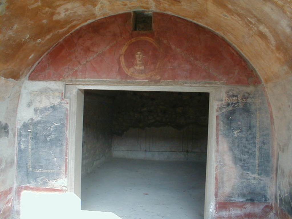 VII.16.17-22 Pompeii. December 2007. Arched north wall with doorway to rear room.