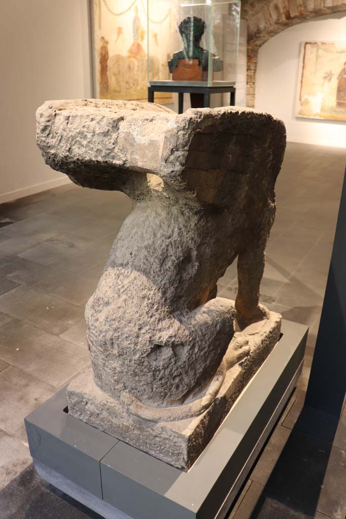 VIII.1.4 Pompeii. February 2021. 
Detail of rear of tufa sphynx-shaped tombstone, re-used as a kerbstone, found at the farm of Fondo Prisco, Boscoreale.
Photo courtesy of Fabien Bièvre-Perrin (CC BY-NC-SA).

