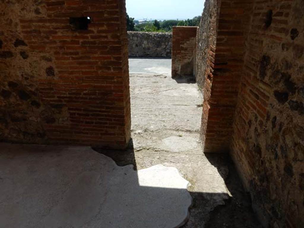 VIII.2.16 Pompeii. May 2018. Looking west across passageway and through another doorway to a room overlooking the east portico. Photo courtesy of Buzz Ferebee.