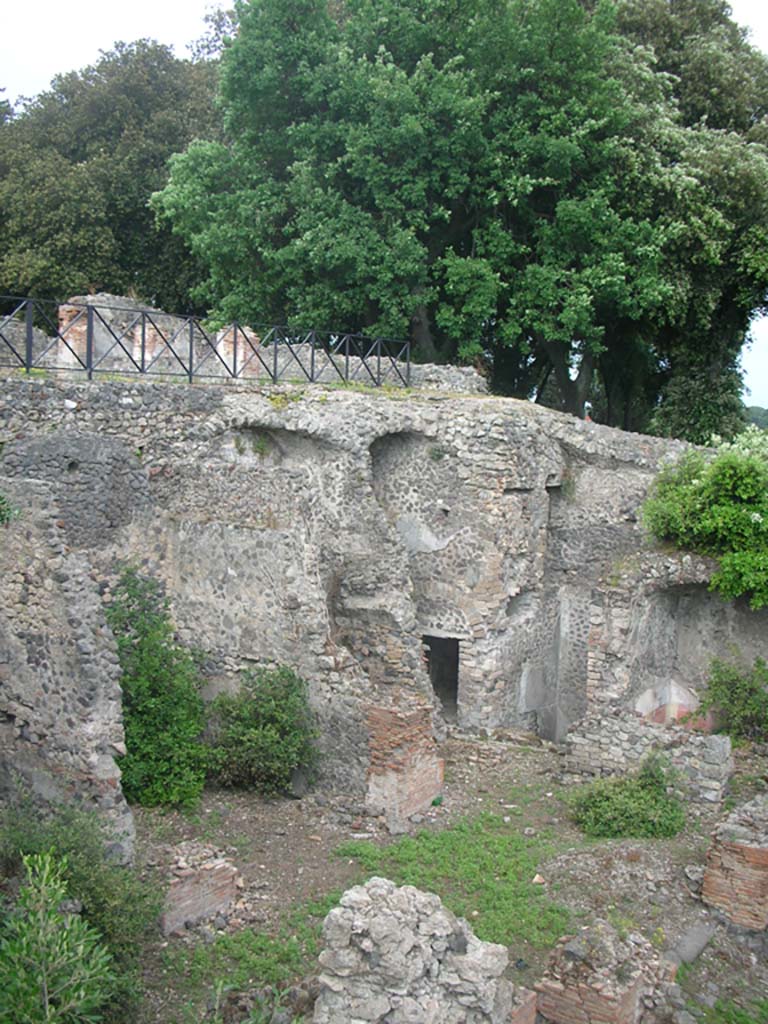 VIII.2.39 Pompeii. May 2011.
First lower floor, looking north-east towards doorway to room f in corridor a’, with steps to second lower floor, centre right.
Photo courtesy of Ivo van der Graaff.