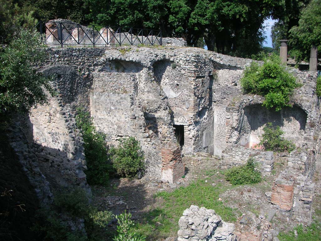 VIII.2.39 Pompeii. May 2011.
First lower floor, looking north-east across room with a door and two windows that opened onto a wide terrace at the rear, on right.
Photo courtesy of Ivo van der Graaff.