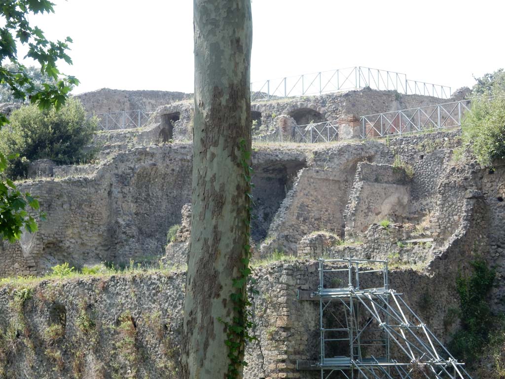 VIII.2.39 Pompeii. June 2019. Looking west towards first lower floor rooms, in centre behind tree.
At the rear, on the upper remaining floor would be the rooms of VIII.2.37. Photo courtesy of Buzz Ferebee.