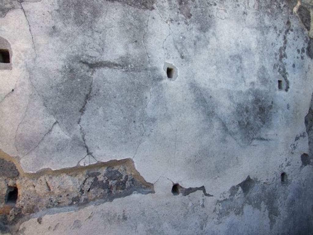 VIII.5.28 Pompeii. March 2009. Room 9. Small room or cupboard. Supports for shelving on South wall.