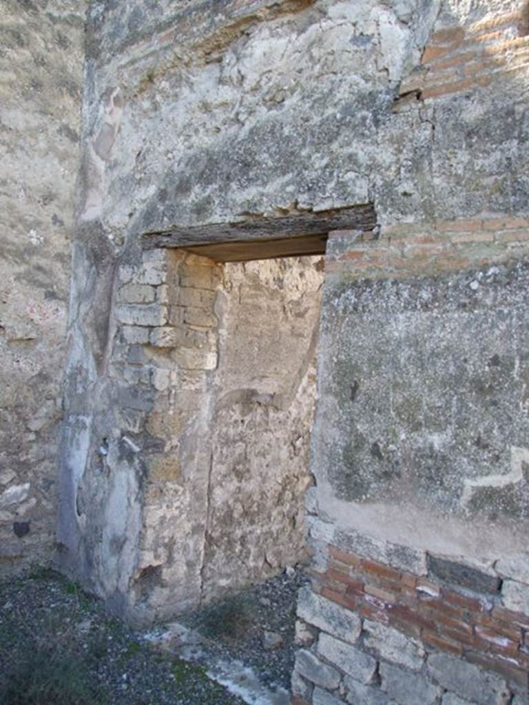 VIII.5.28 Pompeii. March 2009. Small Second doorway to Room 11, Triclinium, on south side of West Portico.