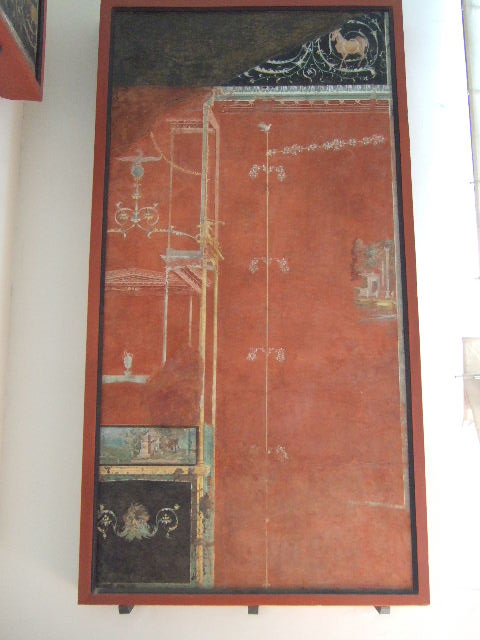 VIII.7.28 Found in Temple of Isis or Tempio di Iside.  Puteal decorated with Hercules with club and wearing a crown and taking part in Bacchic rituals.  Found in the area of the pastophorion (Priest�s rooms).  Now in Naples Archaeological Museum.