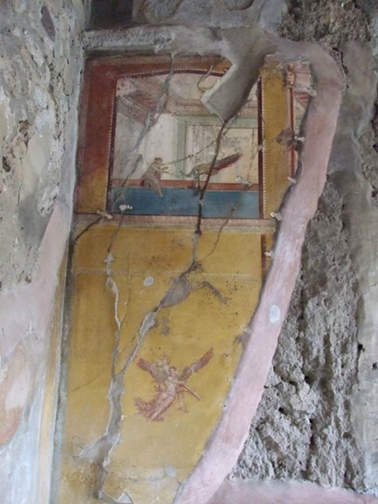 IX.1.7 Pompeii. December 2007. North-west corner of triclinium with remains of painted decoration on north wall.
The Herm on the right side of the remaining painted plaster was topped by the head of Dionysus, and can just be seen.