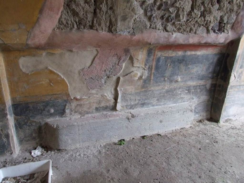 IX.1.7 Pompeii. December 2007. North wall in north-west corner of triclinium, with recess.
The black zoccolo was divided into panels, above it, the predella which was divided by a pilaster, contained two paintings but only one now remains. According to Sogliano, the painting showed a Psyche in a cart pulled by two goats and being led by a cupid, whilst another Psyche, wearing a green robe, followed it.
See Sogliano, A., 1879. Le pitture murali campane scoverte negli anni 1867-79. Napoli: Giannini. (p.68, no.399).
