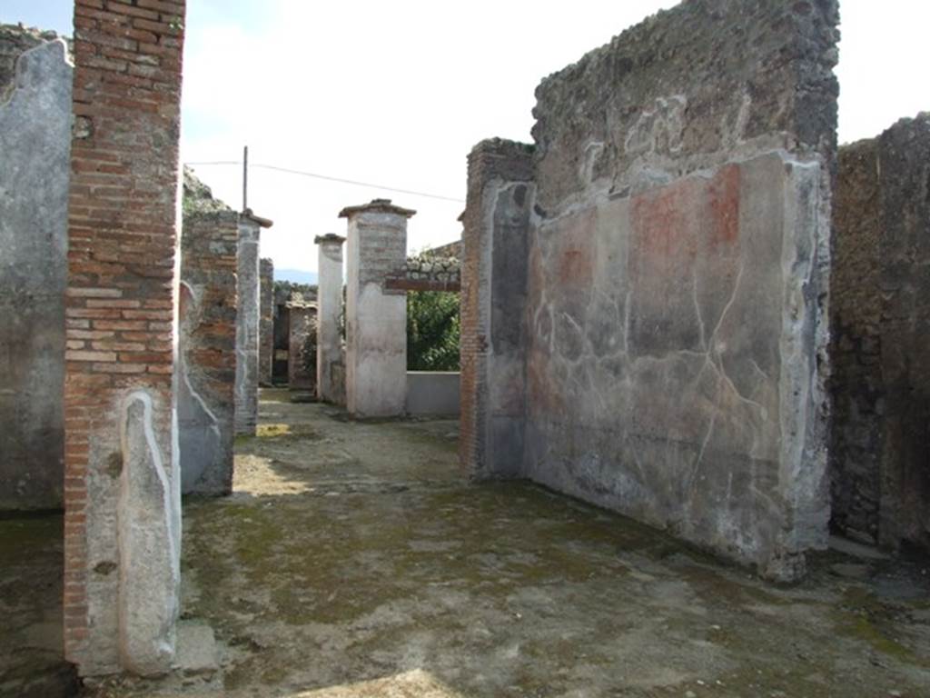 IX.3.5 Pompeii. March 2009. Room 32, west wall of tablinum. The west wall would have been painted with a black dado. In the middle zone, the narrow central compartment would have had a white background. The bordered side panels were probably red and yellow.
At the north end was a red panel, and decoration of candelabra could be seen.
See Bragantini, de Vos, Badoni, 1986. Pitture e Pavimenti di Pompei, Parte 3. Rome: ICCD. (p.444, tablino ‘33’)
