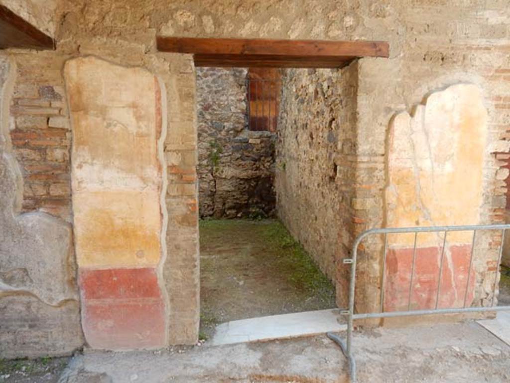 IX.3.5 Pompeii. May 2015. Room 11, doorway in east wall of ala with painted decoration on both sides. Photo courtesy of Buzz Ferebee.