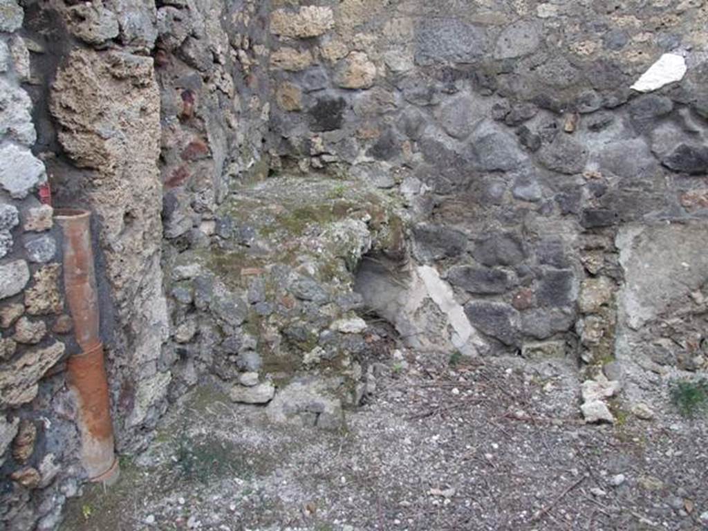 IX.3.15 Pompeii. March 2009. Room 12. Kitchen area in north west corner of portico, with latrine.