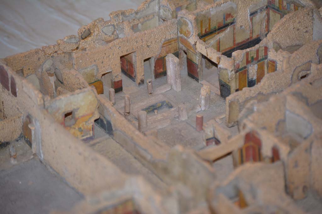 IX.5.17, centre left, and IX.5.18 Pompeii. July 2017. Looking south-west across insula towards atrium and rooms on west side.
From cork model in Naples Archaeological Museum.
Foto Annette Haug, ERC Grant 681269 DÉCOR