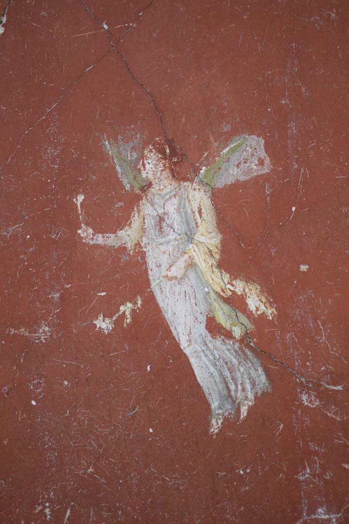 IX.12.6 Pompeii. February 2017.
Room “m”, detail of painting of flying figure from north side of central painting on west wall.
Photo courtesy of Johannes Eber.